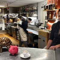 Owner Fatiha and the kitchen  at La TARTE A FAT in Chatte