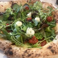 Vegan pizza closer image  at Sophia Loren in Florence