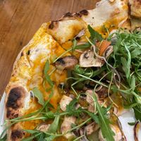 carrot, musgroom, pepper, zuccini and ruccola toppings on the pizza  at In Bocca Al Lupo in Altea