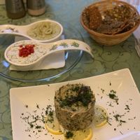 Mushroom terrine, pesto and feta almond cheese appetiser with raw bread  at Barca in Bucharest