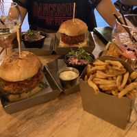 Two vegan burgers, with vegan garlic Rosemary sauce and gin tonics  at Kraft Burger in Liverpool