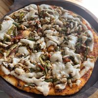 Pizza was cashew cheese   at Tat Cafe in Rishikesh