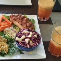 Beans on toast, curry soya meat, beetroot houmous, salads, fresh mix fruit juice at La Rotonda in Tirano
