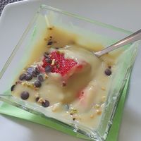 Custard with fruit, nuts and chocolate chunks (picture taken after started eating it) at La Rotonda in Tirano