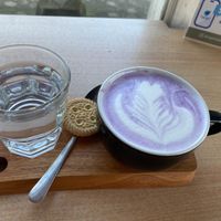 Taro latte with oatmilk (I’d guess the cookie isn’t vegan, I didn’t eat it)  at WARMA - Vegie Bakery & Coffee Shop in Ubud