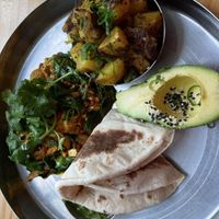 Indian breakfast with avocado - tasty   at Momo Wholefood in Newcastle