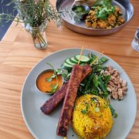 Satay tempeh with salad, and Indian tofu scramble, both so good! at Momo Wholefood in Newcastle