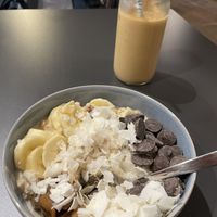 Banana porridge and iced oatmilk latte  at Copenhagen Coffee Lab - Alfama in Lisbon