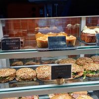 Vegan banana peanut cake at the middle of top shelf at Copenhagen Coffee Lab - Baixa in Lisbon