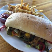 Philly cheesesteak with fries  at Green New American Vegetarian in Phoenix