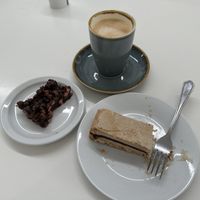 Cake + oat latte  at An Lanntair Cafe Bar in Isle Of Lewis