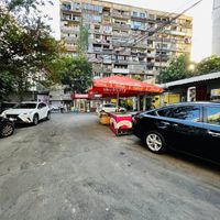 Outside. I entered on Pavstos Buzand St, small alley with a car park barrier. Pass through here and it will open up to this parking lot. The cafe is the last unit on the right.   at 2022_place - Pop Up in Yerevan