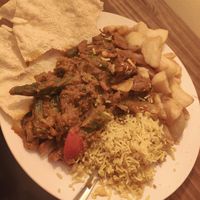 vegan garlic chilli veg curry with garlic pilau rice, a side of bhindi bhaji, chips and poppadoms at Spice Station in South Shields