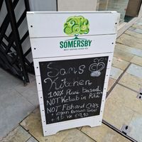 Sign to see in main shopping street at Sams Meat Free Deli in 
