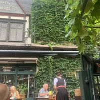 Typical German waitress and waiters  at Weingasthaus Breuer's Rüdesheimer Schloss in Ruedesheim Am Rhein