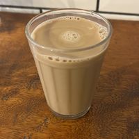 café com leite de aveia  at Matuta Queijaria Vegana in Sao Paulo