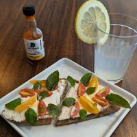 Ricotta and tomato sourdough. This was excellent. at Matuta Queijaria Vegana in Sao Paulo