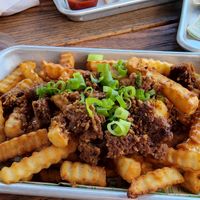 beerchz fries with beyond patty. ok. dry. could be better. where's the chz? at Next Level Veggie Grill in Denver