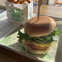 Chick’n Bacon Ranch Burger + Onion Rings  at Next Level Veggie Grill in Denver