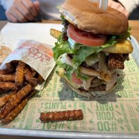 The Animal Stacker with sweet potato fries   at Next Level Veggie Grill in Denver