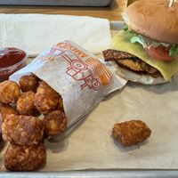 Chicken bacon ranch sandwich with tater tots  at Next Level Veggie Grill in Denver