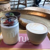 coconut yoghurt bowl and small soy cappuccino   at Mula in Tel Aviv