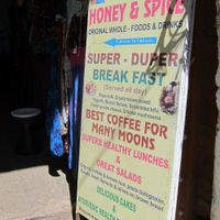 Look for this sign on the street to point you toward the cafe. at Honey and Spice in Pushkar