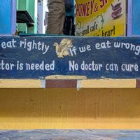 Sign on the top step as you enter at Honey and Spice in Pushkar