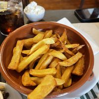 Cuidado que las patatas las sirven con mayonesa con huevo   at Can Shelabi Restaurant in Cadaques