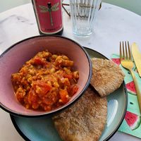 Cauliflower curry with cheezy garlic pitta bread  at The Happy Shroom in Gloucester