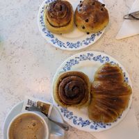 Cinnamon buns, croissant and chocolate chip bun with a soya coffee at Belo Farelo in Porto