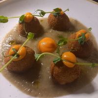 Zucchini/ courgette meters balls with aubergine crem. at I Morgante Bottegabistro in Agrigento