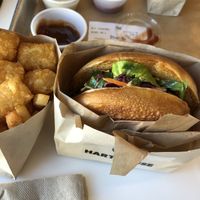 Chick n deluxe with tater tots and fries don’t forget the sauces  at Hart House - Sepulveda in Los Angeles