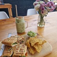 Panini vegan option - mixed vegetables, hummus and sweet sauce + side of guac and chips at The Little Spoon in Panajachel