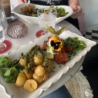 Vegan salad with chicken skewer and vegan salmon with potatoes   at Pink Lettuce in Chester