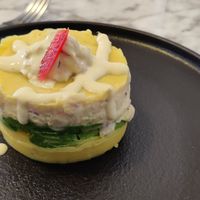 A typical appetizer in Peruvian gastronomy, a dish made with potatoes, limes, chickpeas, yellow hot pepper sauce stuffed with avocados, onions, peas, and celery filling mixed with" at Andean Garden - Cloud Kitchen - Maybe closed in Brooklyn