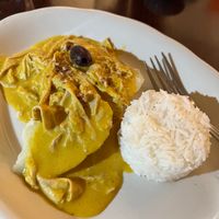 Aji Amarillo Unchicken (entrée of yuba/tofu skin in a creamy sauce made from pecans, bread, oat milk, yellow hot peppers and Peruvian red peppers, served with potatoes and rice) at Andean Garden - Cloud Kitchen - Maybe closed in Brooklyn