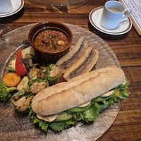 Main course (lunch platter) with mushroom demitasse potage soup, carrot rapé and avocado sandwich, soy meat wraps, fried plantain, grilled vegetables, and soy meat/bean chilli at Cafe Banmari in Mishima