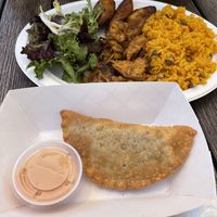 Chicken sampler plate and pork pastelillo  at Casa Borinqueña in San Francisco