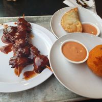 BBQ chicken Pincho, Lulu's Famous Pastelillo (Impossible beef), and Relleno de papa. Yum! at Casa Borinqueña in San Francisco
