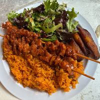 Sampler platter with pinchos (chicken skewers) at Casa Borinqueña in San Francisco