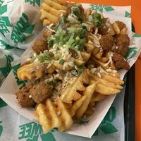 Cluckin Waffle Fries (Sharing size)  at Oowee Vegan in Brighton