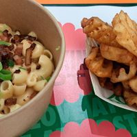 Mac and cheese and bacon bits, and marmite waffle fries at Oowee Vegan in Brighton