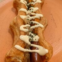 Puffy Dog (hot dog with puffy pastry instead of bread) and dijonaise (Dijon mustard with mayo). The sausage is tofu made. at Holy Llama - Sintagma in Athens