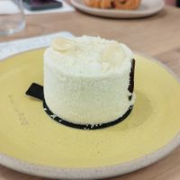 An "Exotic" dessert. Coconut sponge cake, has mango in the center which makes it just a perfect combination of flavours. Exquisite. at Holy Llama - Sintagma in Athens