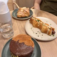 Almond croissant, hotdog puff and pistachio wheel  at Holy Llama - Sintagma in Athens