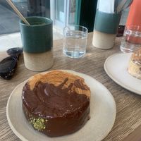 Pistachio pin wheel, fredo cappuccino and cinnamon bun   at Holy Llama - Sintagma in Athens