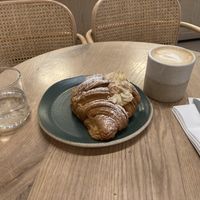 Almond croissant and pea milk cappuccino   at Holy Llama - Sintagma in Athens