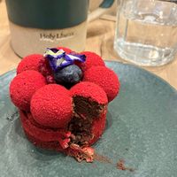 Red confessions and a café latte with oat milk. at Holy Llama - Sintagma in Athens