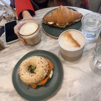 Salmon bagel, croissant sandwich, chai latte with oat milk and regular latte with oat milk   at Holy Llama - Sintagma in Athens